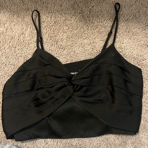 A black blouse from Express. Has a sheer lining underneath the tie.